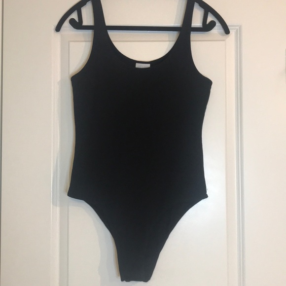 Abound Tops - 🦋 Abound Solid black cotton bodysuit with snap